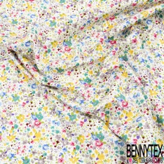 Coton imprimé petite fleur gracieuse ton bleu violine fond blanc discret