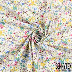 Coton imprimé petite fleur gracieuse ton bleu violine fond blanc discret