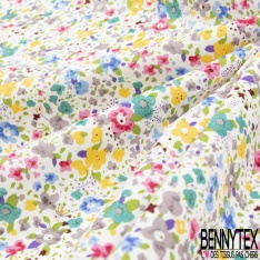 Coton imprimé petite fleur gracieuse ton bleu violine fond blanc discret