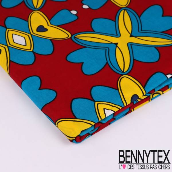 Wax Africain N°116 : Motif Caléïdoscope bleu, jaune, blanc sur fond rouge cerise Wax Africain N°116 : Motif Caléïdoscope bleu, jaune, blanc sur fond rouge cerise