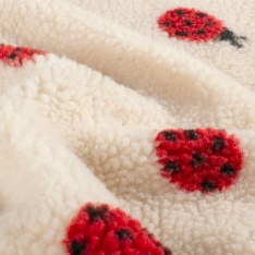 Sherpa Fleece tissu jacquard coccinelle fond blanc cassé