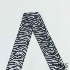 Bande élastique motif zébrure beige lurex argent fond noir