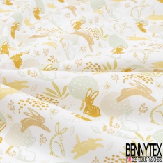 Coton imprimé esprit toile de jouy fond or pépite