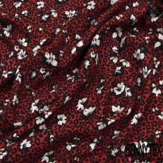 Crêpe viscose fluide fleur de tiaré et île tropicale fond noir profond