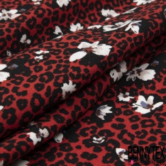 Crêpe viscose fluide fleur de tiaré et île tropicale fond noir profond