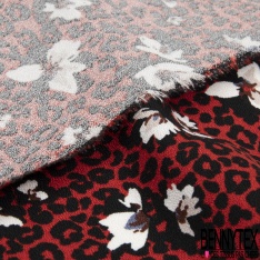 Crêpe viscose fluide fleur de tiaré et île tropicale fond noir profond