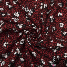 Crêpe viscose fluide fleur de tiaré et île tropicale fond noir profond