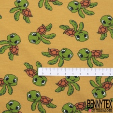 Jersey Coton Elasthanne motif petites tortues rigolotes fond jaune d'oeuf