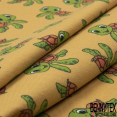 Jersey Coton Elasthanne motif petites tortues rigolotes fond jaune d'oeuf