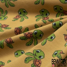 Jersey Coton Elasthanne motif petites tortues rigolotes fond jaune d'oeuf
