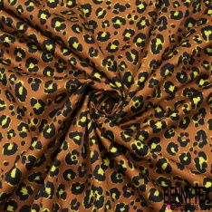 Satin de coton élasthanne imprimé léopard noir orange brûlée fond blanc discret