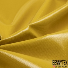 Gabardine de coton sergé plastifiée or de pépite